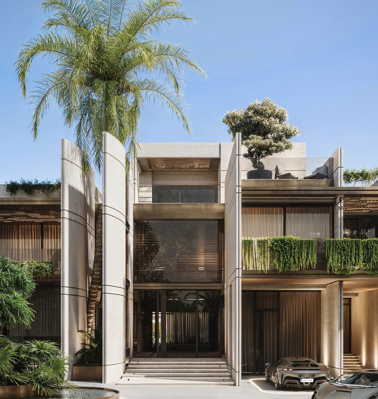 A residential facade with planting and outdoor spaces