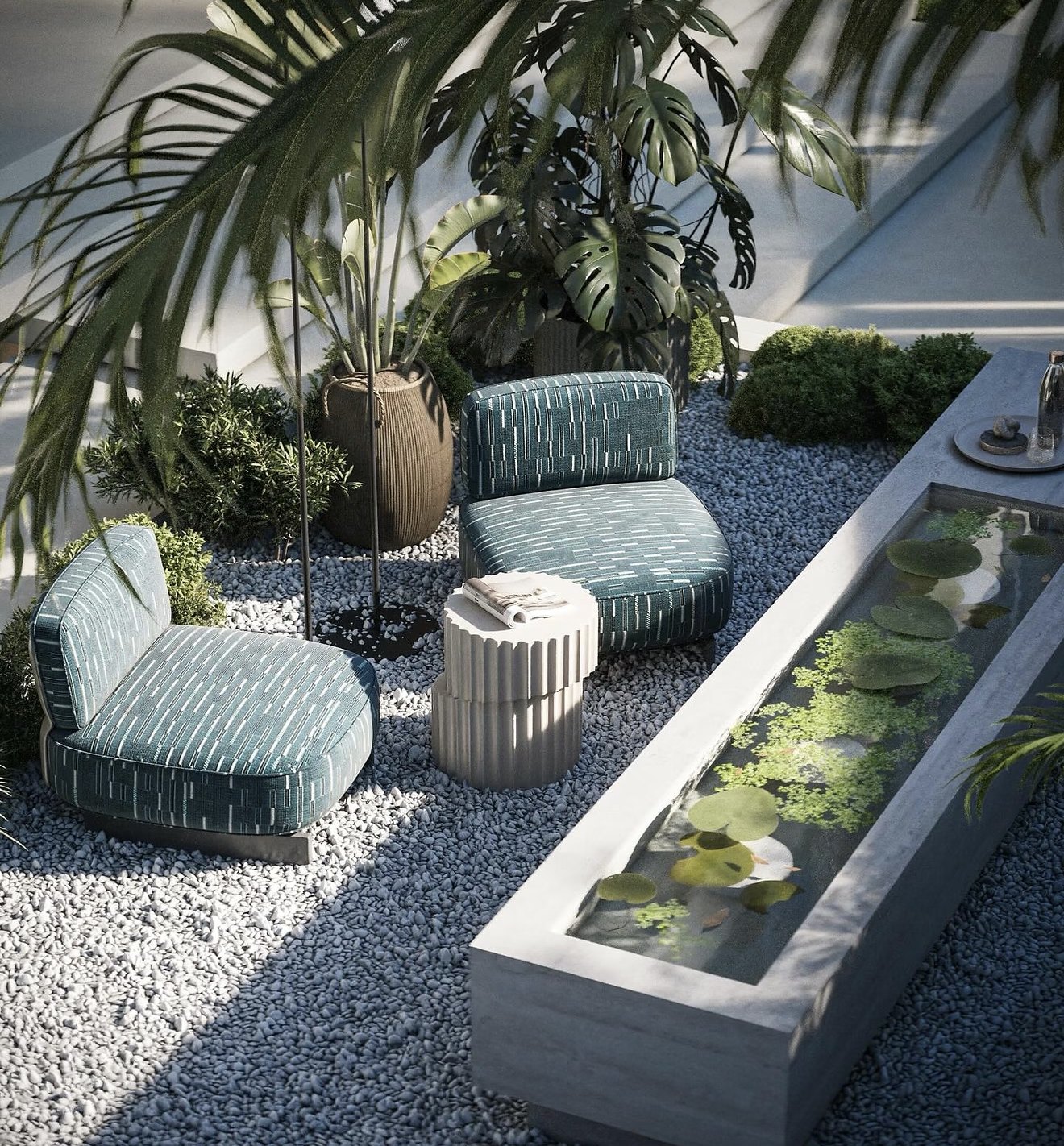 Outdoor seating beside a water feature and plants